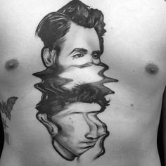 a man's chest with an image of himself in the center and his reflection on it