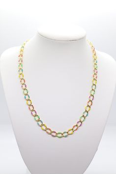 This necklace is a beautiful piece of jewelry that will add a touch of elegance to any outfit. It is made of a small chain that is multi-colored, with each link a different shade of the rainbow. The necklace is adjustable, so you can wear it as a choker or a longer necklace. It is a great addition to any jewelry collection. Multicolor Link Jewelry With Adjustable Chain, Multicolor Link Chain Jewelry, Trendy Colorful Chain Jewelry, Multicolor Chunky Chain Link Jewelry, Multicolor Long Chain Necklace, Multicolor Long Necklace Jewelry, Multicolor Adjustable Chain Link Necklace, Colorful Chain Necklace For Gifts, Green Adjustable Chain Link Necklace