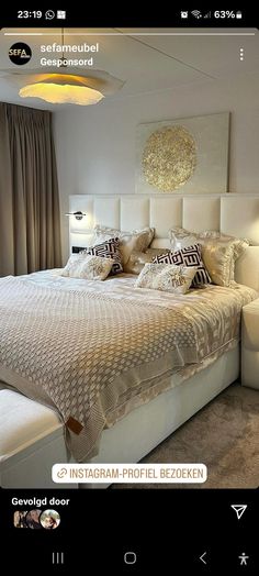 a bed room with a neatly made bed and pillows