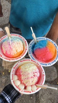 three bowls filled with different colored ice cream