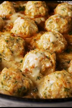 a pan filled with meatballs covered in cheese