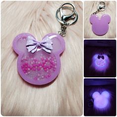 the keychain has been made to look like minnie mouse's ears and is glowing