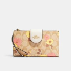 a coach purse with flowers on it