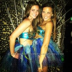 two young women dressed in costume posing for a photo