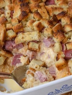 a casserole dish with ham and bread croutons