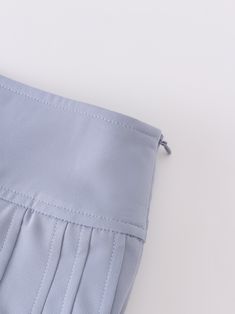 Expertly crafted with a stunning pleated design, the Yolk Pleated Skirt in Grey Blue offers 37 inches of sophisticated style. Elevate your wardrobe with this essential piece that effortlessly combines fashion and function. Solid Chic Pleated Skirt, Chic Pleated Skirt With Folds, Gray Pleated Mini Skirt For Spring, Elegant Solid Bottoms With Folds, Elegant Blue Pleated Skirt With Accordion Pleats, Elegant Pleated Pencil Skirt Bottoms, Elegant Blue Pleated Skirt, Elegant Long Skirt With Folds, Elegant Accordion Pleated Mini Skirt