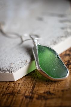 Statement green sea glass pendant made with recycled sterling silver, finished with a 16" sterling silver snake chain.  Handmade by me from Cornwall. All of my jewellery is unique and made slightly differently to suit the shape and size of sea glass or ceramic I work with. Sea Glass Large Pendant Necklace, Sea Glass Pendant, Silver Snake Chain, Green Sea, Christmas Deals, Recycled Sterling Silver, Snake Chain, Glass Pendant, Glass Pendants