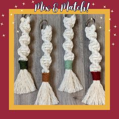 four white tassels with different colors on them