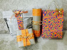 three wrapped presents sitting on top of a table