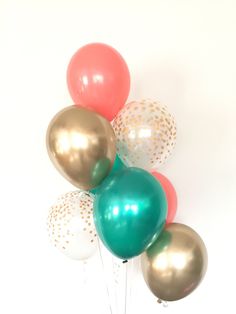 a bunch of balloons that are in the air