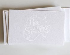 three white cards with the words be smiling on them, sitting next to each other