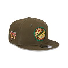 the new era snapback hat is available in olive green and features embroidered patches on the front