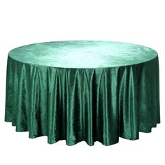 a round table covered in green velvet