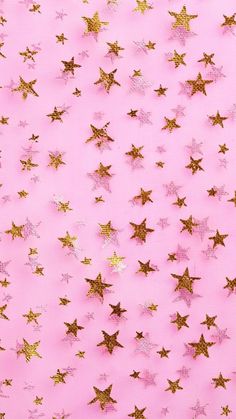 a pink background with gold stars on the top and bottom, all in different sizes