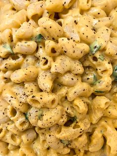 macaroni and cheese is mixed together in a creamy, cheesy sauce