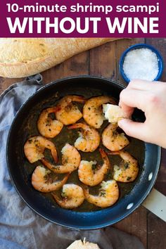 shrimp is being cooked in a skillet with garlic and parmesan cheese on the side