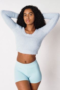 The fuzzy sweater is back just the way you remember it. This long sleeve sweater features a scoop neckline and cropped fit. Pairs perfectly with our 8385GD Garment Dye Mini Skirt for a girly look or update this style by pairing it with sweatpants for a relaxed look. This premium knit garment is knit in the U.S.A. by workers earning a fair wage. Fully Fashioned is the term used to describe the process in which each garment is shaped using special stitches that make lines and loops that either shr Slouch Socks, Fuzzy Sweater, Yoga Shorts, Cute Sweaters, Baby Sweaters, Just The Way, Sweater Fashion, Sleeve Sweater, Womens Clothing Tops