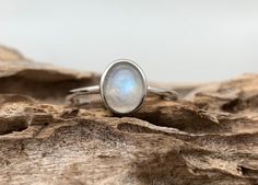 Hi everyone, just wanted to let you know we are open and shipping daily. Moonstone Silver Ring // Simple Small Oval Moonstone Ring // Minimalist Moonstone Ring // Dainty Design Moonstone Ring // June Birthstone Size: 5 to 10 Weight: 2.5 grams Face Height: 10mm Band: 2mm Hallmark 925 Love this small dainty design, skinny band great for stacking. Smooth rainbow blue moonstone is a healing stone. Minimalist Oval Cabochon Opal Ring, Stackable Rings With Moonstone Gemstones, Oval Moonstone Gemstone Stackable Rings, Minimalist Oval Moonstone Ring For Everyday, Oval Moonstone Stackable Rings With Gemstone, Everyday Oval Moonstone Ring, Minimalist Oval Moonstone Ring, Minimalist Moonstone Moon-shaped Ring, Minimalist Oval Moonstone Birthstone Ring