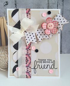 a handmade card with buttons and ribbons on it, saying thank you for being a friend