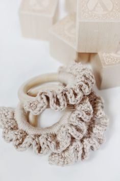 two crocheted rings sitting next to each other on top of a white surface