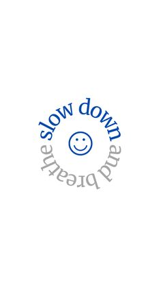 the words slow down are in blue and grey letters on a white background with a smiley face