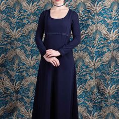 📏 Size 42 (L) 🎨 Midnight blue color ✂️Polyester crepe 🚿 machine washable at 30oC Long dress in midnight blue viscose/polyester crepe  Soft and fluid like silk, the Ann Elliott dress is a wise and sober dress.  With a cut, however, very inspired by the Regency period (England 1811-1820).  Its long, straight-cut sleeves and the waist are trimmed with tone-on-tone cotton lace.  The dress is cut flared and long, the back is slightly longer.  The back closes with a zip, the dress is cinched with t Elegant Fitted Blue Medieval Dress, Elegant Blue Medieval Dress, Regency Style Blue Dress With Historical Design, Regency Style Long Sleeve Medieval Dress, Blue Regency Style Evening Dress, Regency Style Medieval Dress With Fitted Bodice, Blue Regency Style Floor-length Dress, Jane Austen Style, Vintage Ball Gown