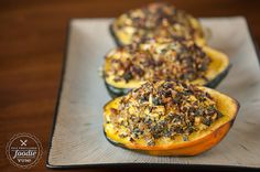 three stuffed acorns on a plate with toppings