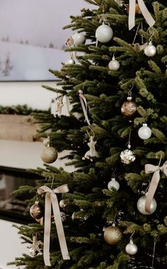 a christmas tree with ornaments hanging from it