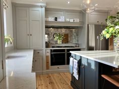 a kitchen with an island, stove and sink