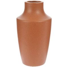 a brown vase sitting on top of a white table