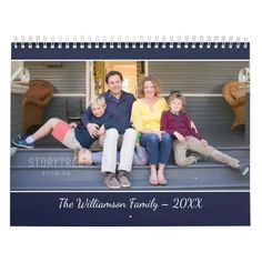 a family sitting on the front steps of their home for an upcoming photo calendar, which is printed with your own photos