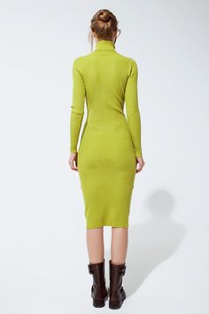 Step into a world of elegance and comfort with our Elegant Serenity Green Midi Dress. This timeless piece, designed with a sophisticated turtle neck, is the perfect addition to your wardrobe, providing both style and warmth. Model’s Size Guide: Our stunning model showcases this dress in a size S, with her graceful height of 5'10'' and measurements of 31-23-35. The dress is crafted to provide a true-to-size fit, ensuring a flattering and comfortable wear for all. Premium Fabric Blend: Made from a Green Long Sleeve Turtleneck For Spring, Elegant Stretch Green Midi Dress, Elegant Green Midi Dress For Fall, Green Winter Workwear Dress, Formal Green Stretch Midi Dress, Green High Neck Dress For Fall, High Neck Green Dress For Fall, Fall Season High Neck Green Dress, Elegant Solid Color Turtleneck Dress