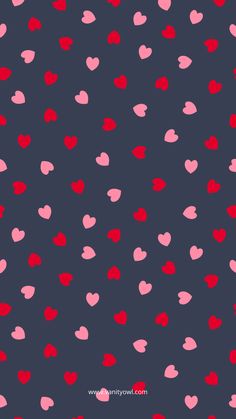 red and pink hearts on a dark blue background for valentine's day wallpaper