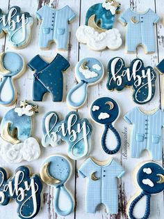 baby shower cookies are arranged on a table