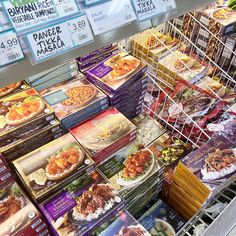 a display in a grocery store filled with lots of food