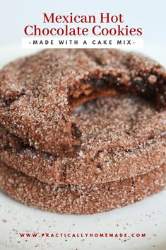 mexican hot chocolate cookies made with a cake mix on a white plate and topped with powdered sugar