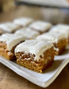 there are several pieces of cake on the plate and one is frosted with icing