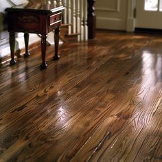 a wooden floor in a house with stairs