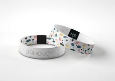 "A super simple white wristband allows for this powerful, yet simple message, to be seen! The words \"SPREAD JOY\" are written in a simple text with no distractions. A message for personal inspiration and a helpful reminder for those we pass through our day. The reversible option of this Moxxie band features little splatters of color, like drops of paint. Little splashes of joy in yellow, pink, teal and dark blue. Allow for the paint splashes to symbolically remind you to be playful, sometimes having fun makes a mess. This Moxxie wristband says it's okay to drop a little paint, it's okay to be a little messy, Spread Joy anyway! This listing is for 1 wristband. All wristbands are made from recycled materials and are stretchy to fit a variety of sizes.  All designs are limited edition, seria Adjustable White Band Bracelet, Casual White Wristband For Everyday, Awareness Bracelet, Wristband Bracelet, Minimalist Flowers, Paint Splash, Wristbands, Cute Keychain, Flower Charm