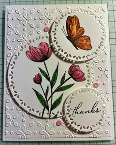 a card with flowers and butterflies on it