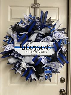 a blue and white wreath that says, closed are the peacemakers