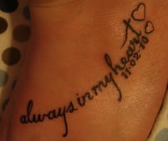 a foot with the words always in cursive writing on it