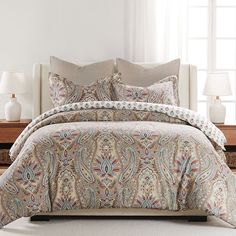 the comforter is neatly made and ready for someone to use it in their home