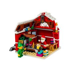 a lego christmas house with santa and elves