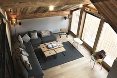 an overhead view of a living room with couches and tables