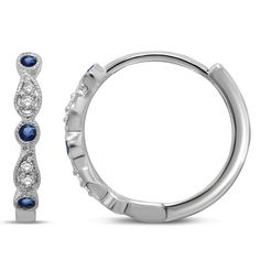 Timeless luxury glamorous earring; beautiful Genuine Blue Sapphire And Round Cut Diamond Hoop Earrings in 14k White Gold 0.08 ct. tw. embedded in round and pear shape, set in prong setting. This hanging dangly hoop earrings pair with easy lock Lever back closure. Simply gorgeous high fashion bling jewel; shiny bling polished finish accessory for all ages. Blue Sapphire Hoop Earrings classic cut; bright sparkling gem eternal hoops for sophisticated elegance. This chic edgy lovely hoops can be worn for work office cocktail party night and dinner date special days. Long lasting high shine earring pair for everyday daily wear. Lightweight comfy can be worn all day.   PRODUCT INFORMATION Metal Content : 14k Metal Color : White Gold Style : Hoop Earrings STONE INFORMATION Total Carat Weight : 0. Sapphire Hoop Earrings, Timeless Luxury, Blue Sapphire Diamond, Diamond Hoop Earrings, Sapphire Diamond, Diamond Clarity, Round Cut Diamond, Stone Earrings, Gemstone Earrings