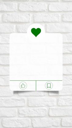 a white brick wall with a green heart sticker on the front and back of it