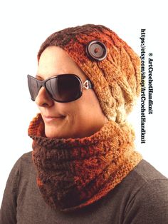 a woman wearing sunglasses and a knitted hat with buttons on the side, has a scarf around her neck