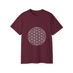 a maroon t - shirt with the flower of life in white on it's chest