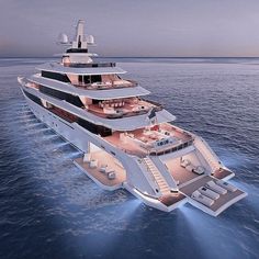 a large white boat floating on top of the ocean